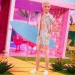 Mattel - Barbie The Movie Doll Ken Wearing Pastel Striped Beach Matching Set